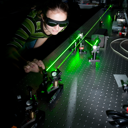 Women with green laser equipment